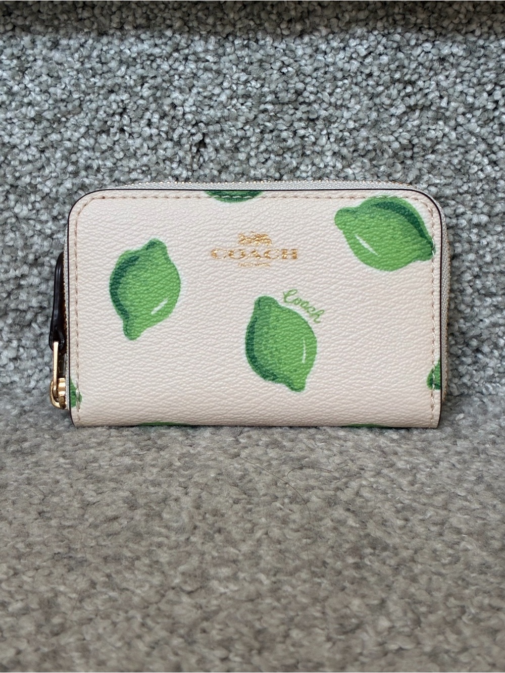 Coach small zip around card case; lime print